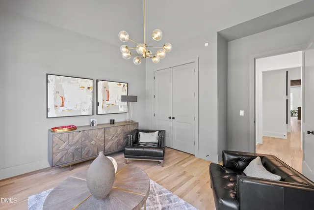 a bedroom with a bed and a flat screen tv in it