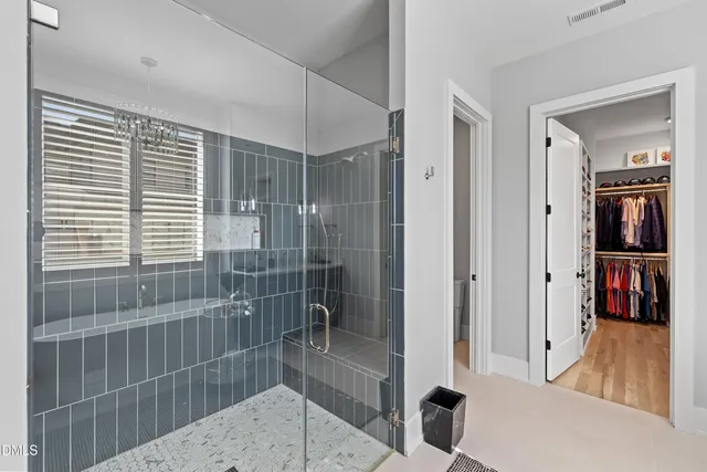 an aerial view of a house with a yard basket ball court and outdoor seating