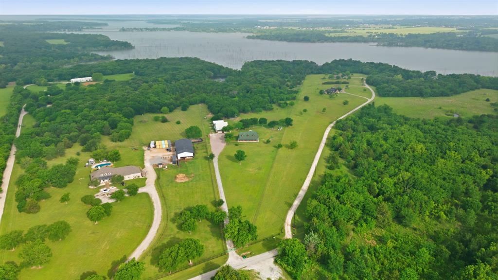 465 Emberson Ranch Road Pilot Point, TX 76258 - Photo 2 of 40 a view of a lake with a mountain