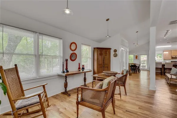 a room with lots of furniture and windows