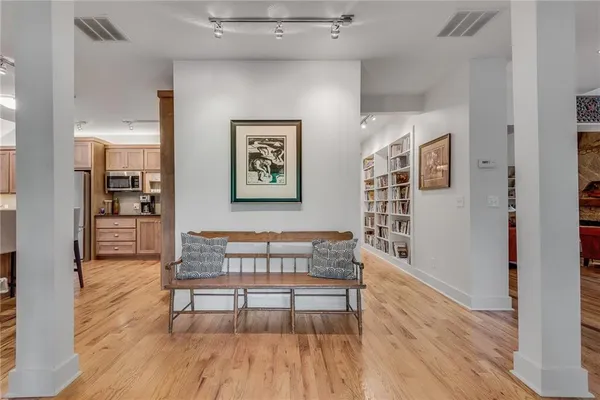 a view of a livingroom with furniture and wooden floor