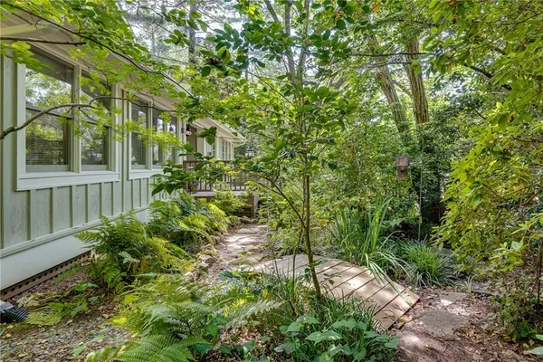 a backyard of a house with lots of green space