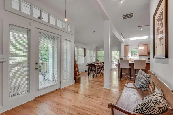 a view of a dining room with furniture window and wooden floor