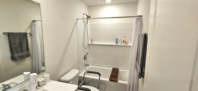 a bathroom with a shower and a toilet