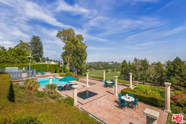 a view of a swimming pool with a patio