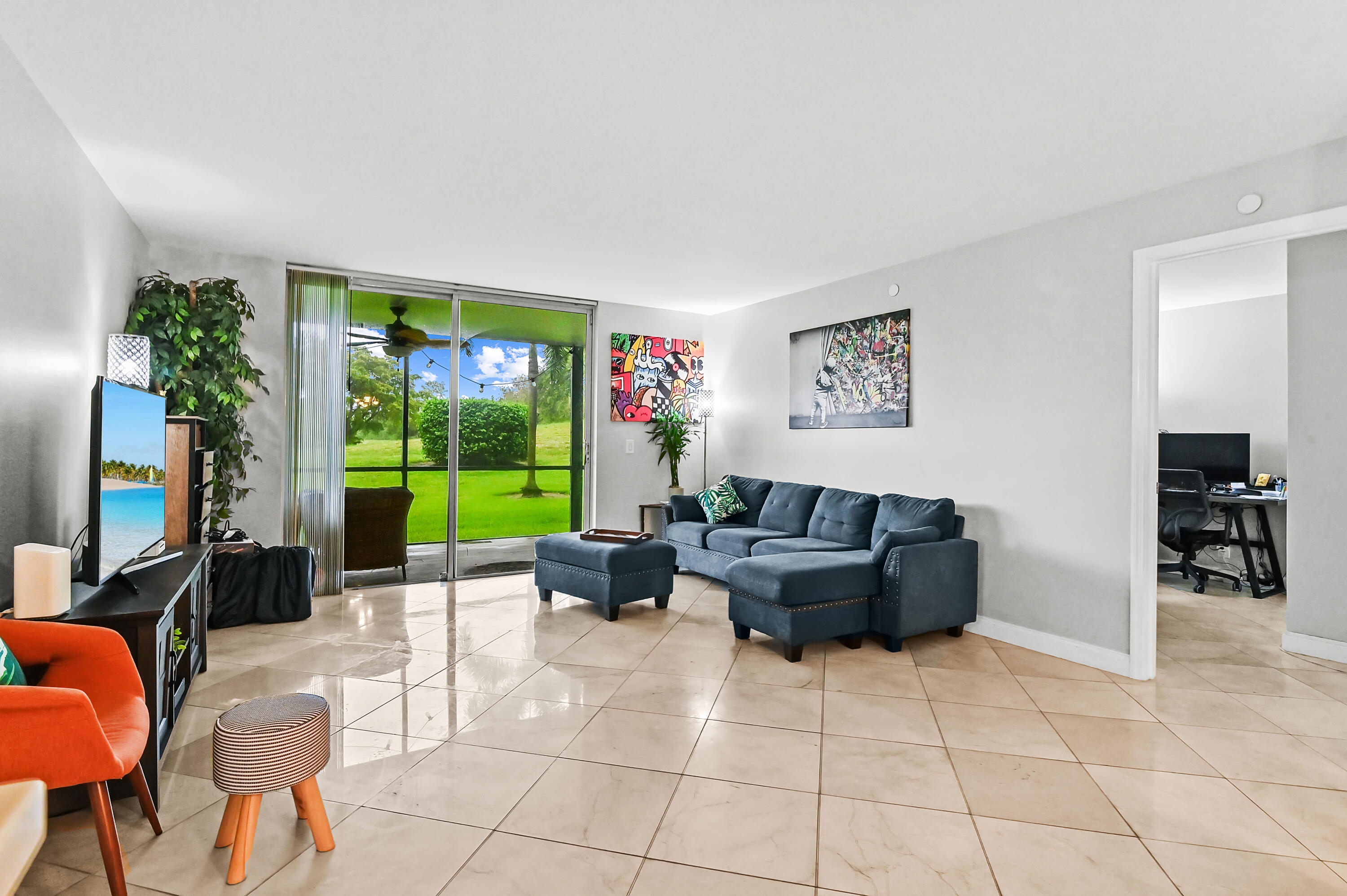 6400 Northwest 2nd Avenue, Unit 124 Boca Raton, FL 33487 - Photo 15 of 33 a living room with furniture and a large window