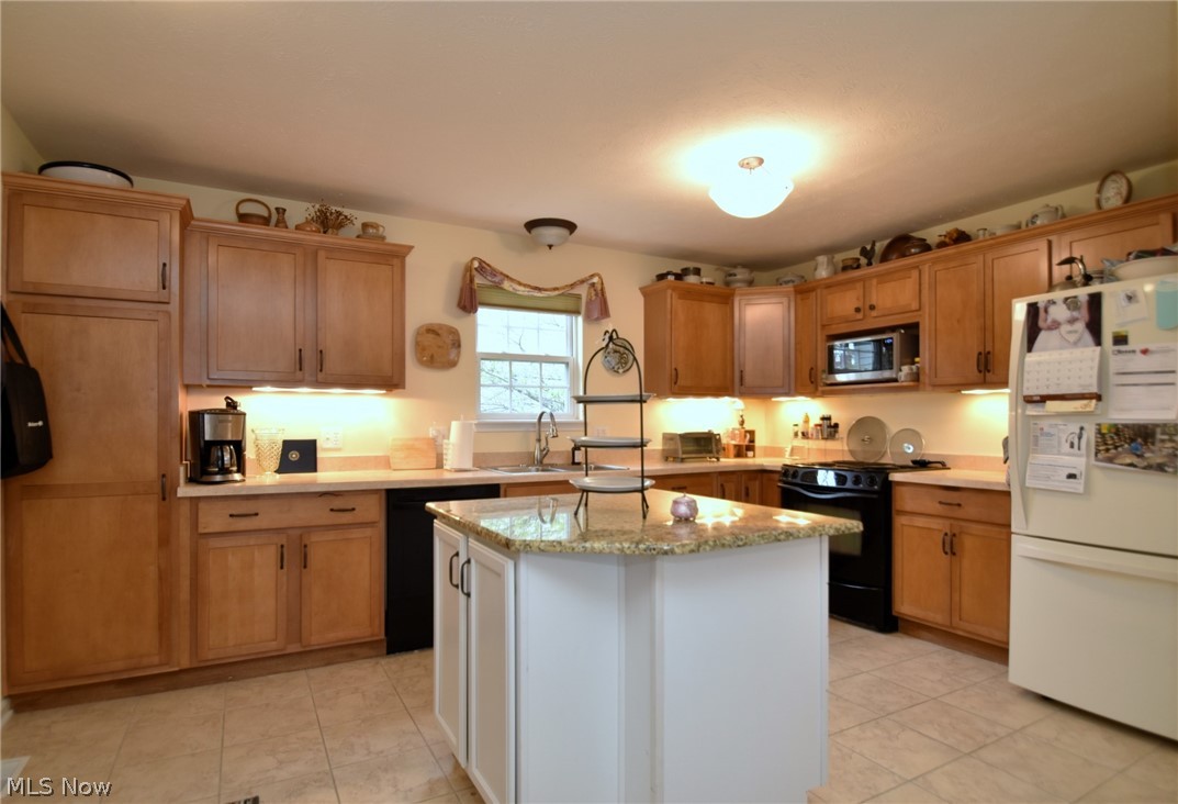 23825 Rockside Road Bedford, OH 44146 - Photo 9 of 22 Kitchen featuring a center island