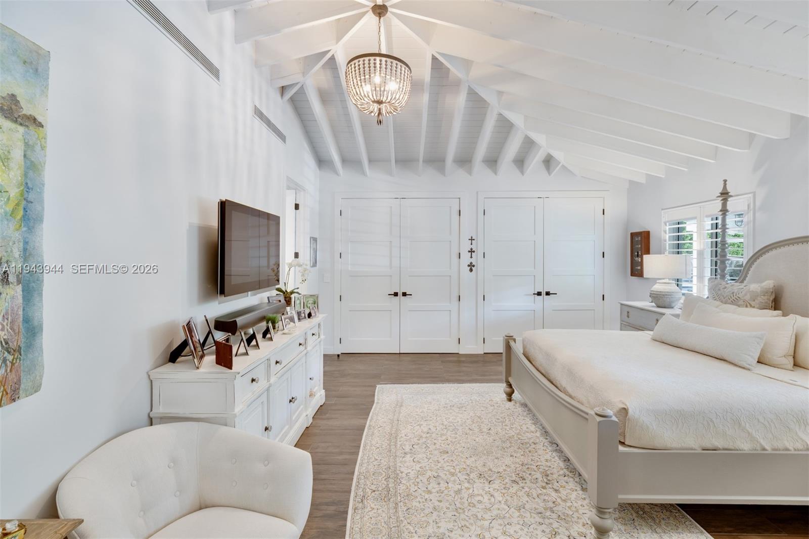 13333 Southwest 59th Court Pinecrest, FL 33156 - Photo 11 of 16 a living room with furniture and a flat screen tv