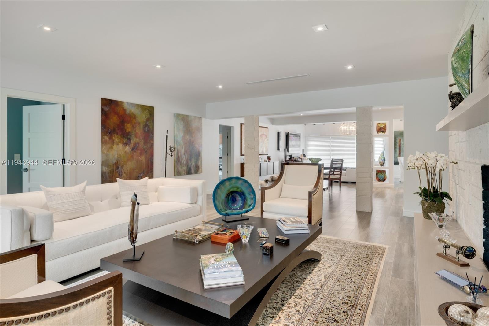 13333 Southwest 59th Court Pinecrest, FL 33156 - Photo 4 of 16 a living room with furniture and a table
