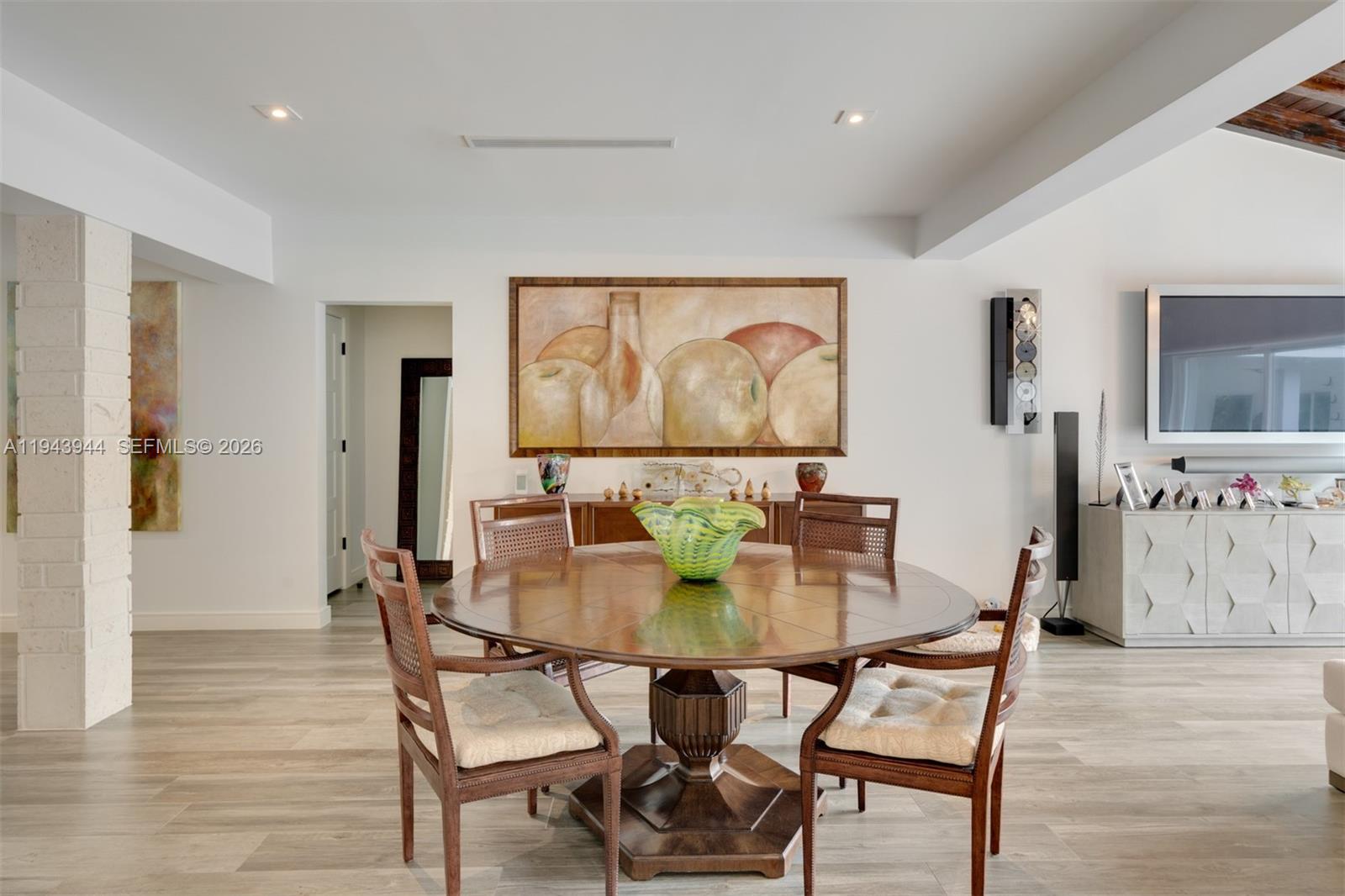 13333 Southwest 59th Court Pinecrest, FL 33156 - Photo 5 of 16 a dining room with furniture and wooden floor
