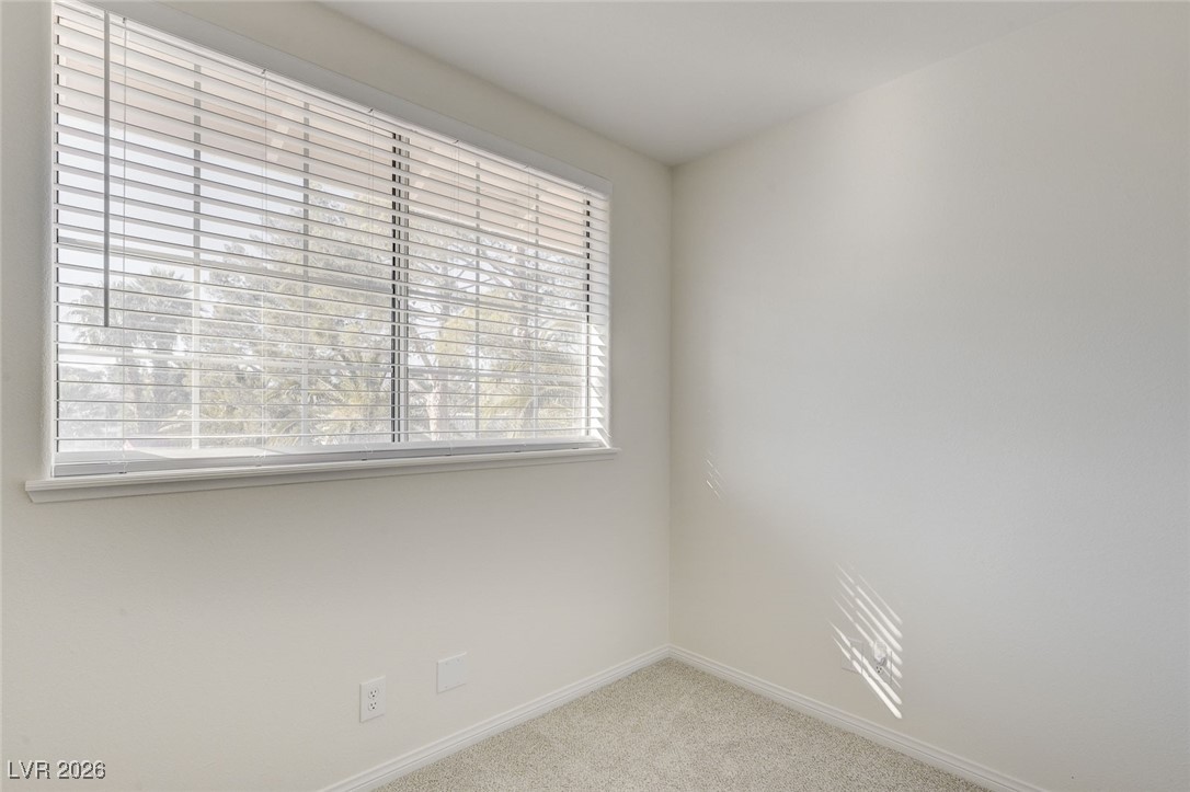 2955 El Camino Road Las Vegas, NV 89146 - Photo 67 of 99 Unfurnished room with light colored carpet and baseboards