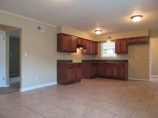 a kitchen with stainless steel appliances a refrigerator and a sink