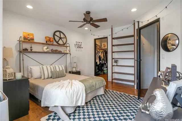 a bedroom with bed and a chandelier