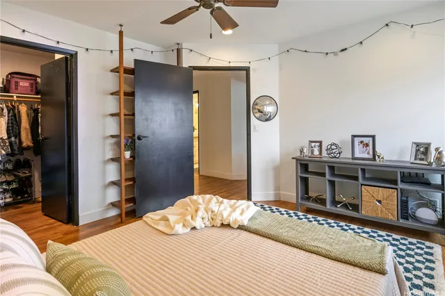 a bedroom with a bed and a television