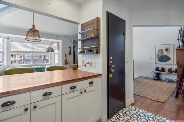a view of living room with furniture and flat screen tv