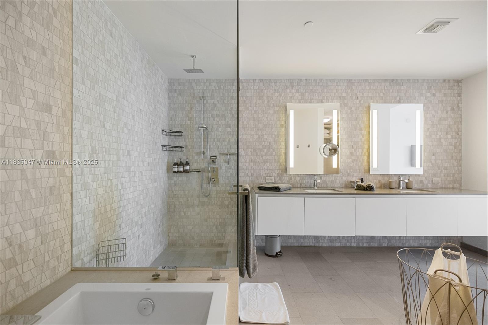 88 Southwest 7th Street, Unit 1010 Miami, FL 33130 - Photo 15 of 42 a bathroom with a granite countertop bathtub sink vanity and toilet