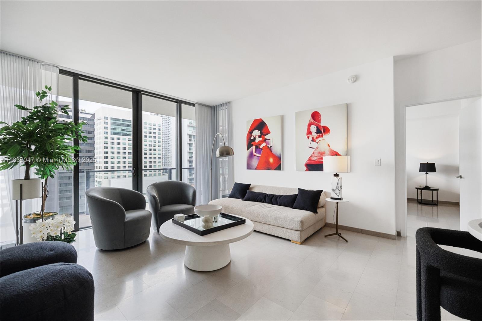 88 Southwest 7th Street, Unit 1010 Miami, FL 33130 - Photo 22 of 42 a living room with furniture and a potted plant