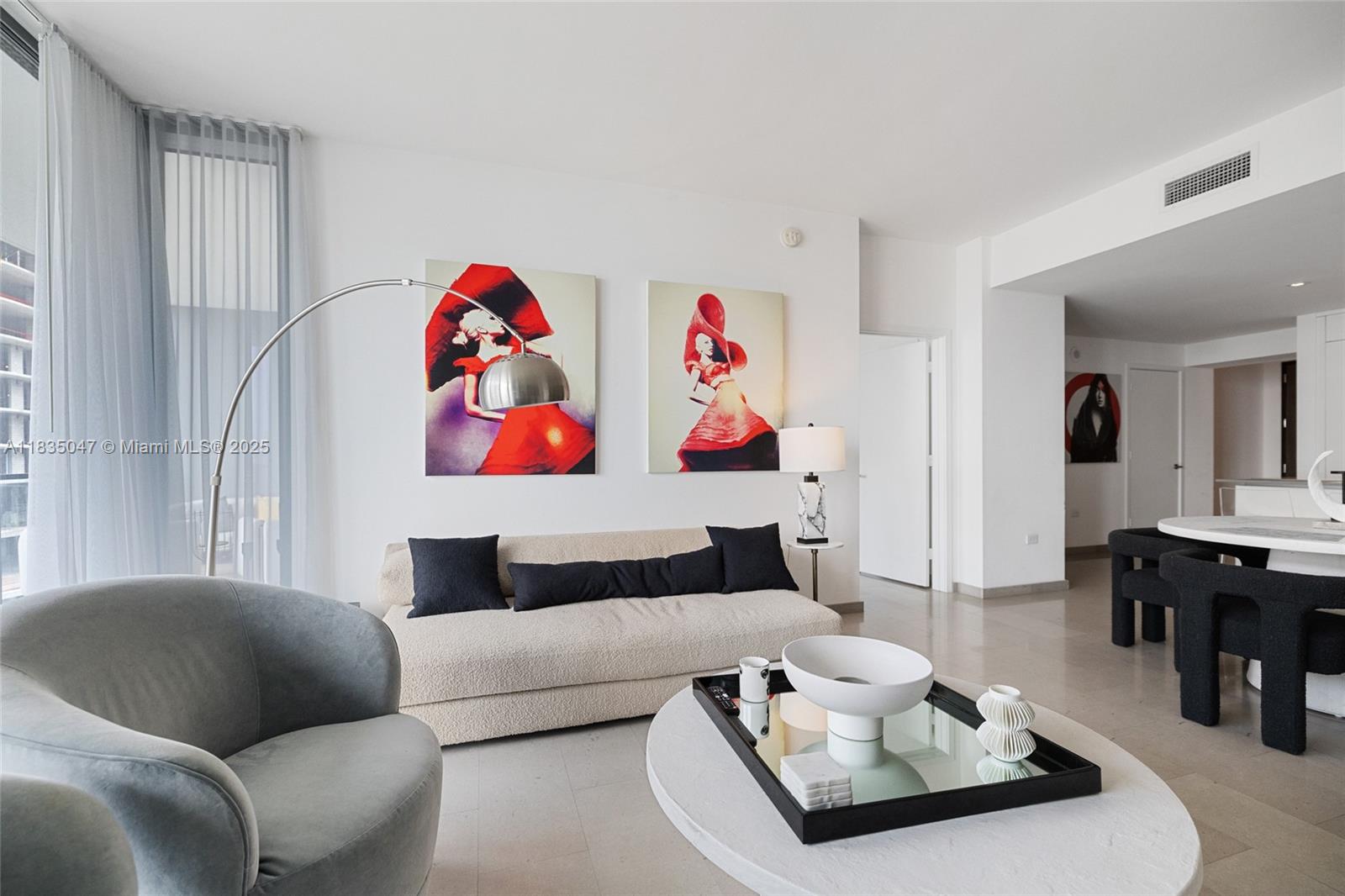 88 Southwest 7th Street, Unit 1010 Miami, FL 33130 - Photo 23 of 42 a living room with furniture and a couch