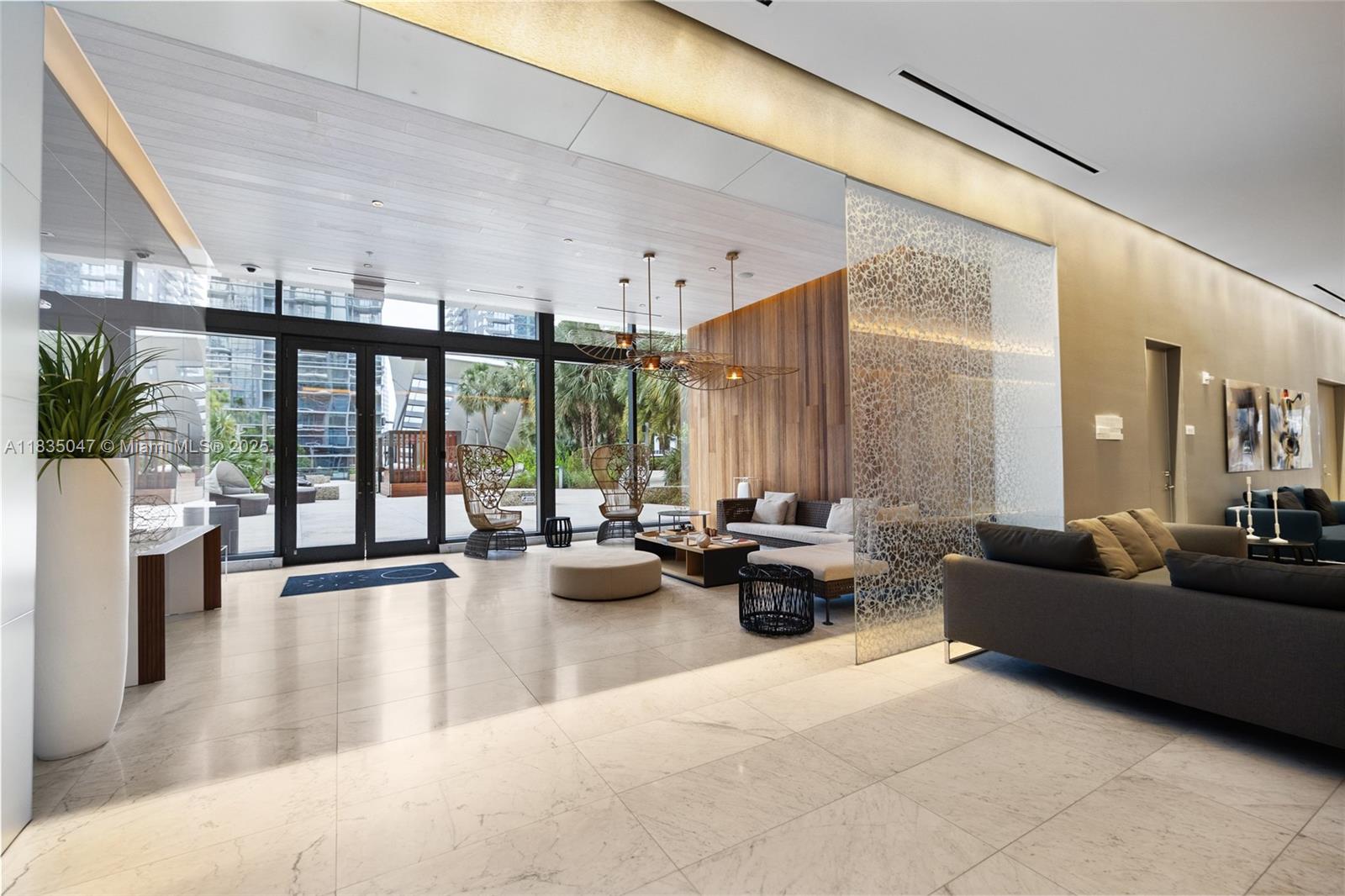 88 Southwest 7th Street, Unit 1010 Miami, FL 33130 - Photo 42 of 42 a living room with furniture and large windows