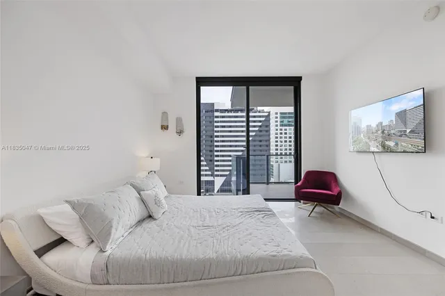 a bedroom with a bed and a couch