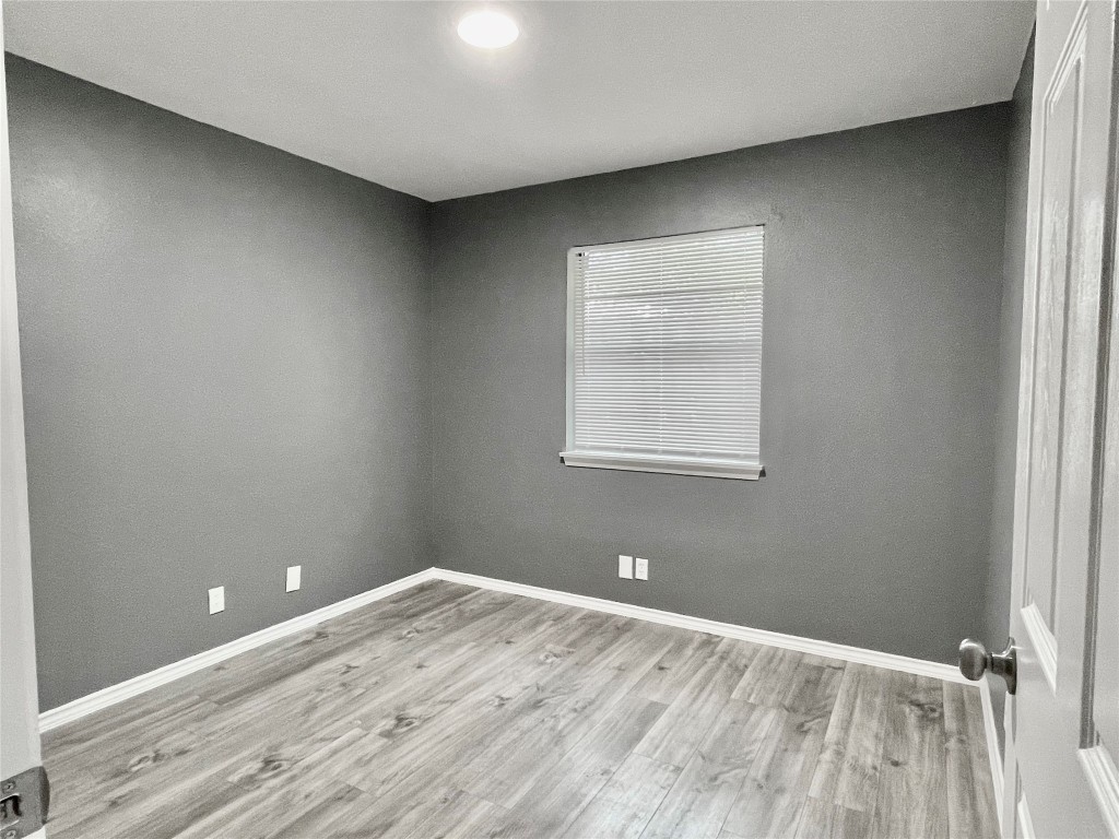 5929 Alsace Trail Austin, TX 78724 - Photo 11 of 18 an empty room with a workspace