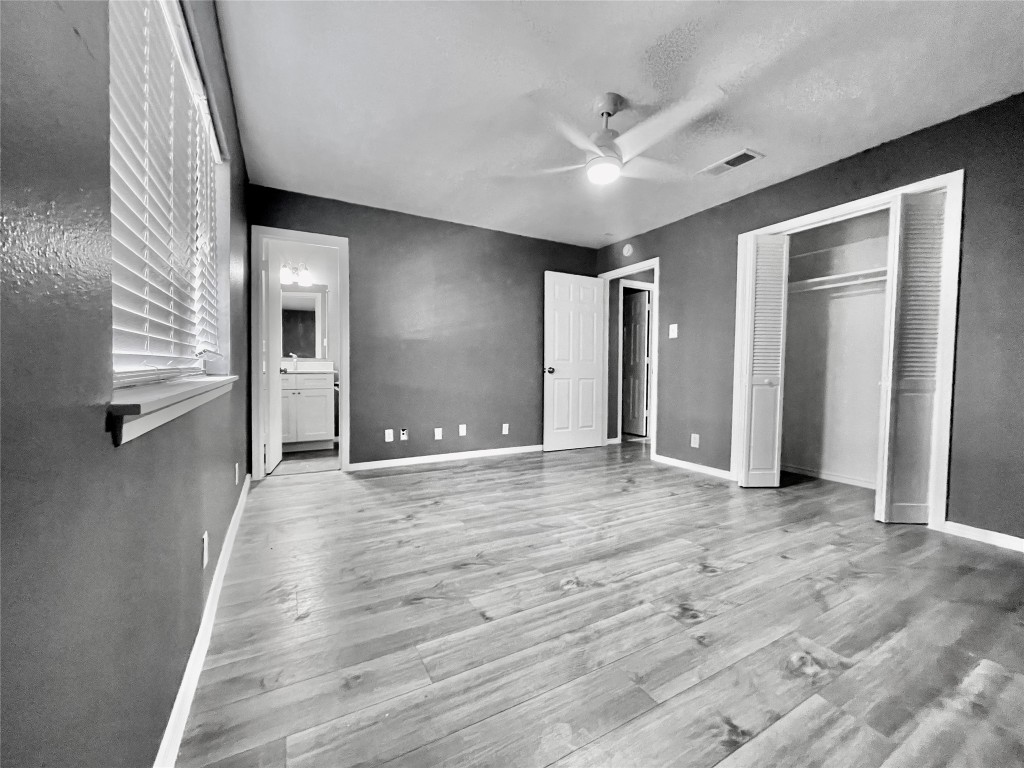 5929 Alsace Trail Austin, TX 78724 - Photo 15 of 18 a view of empty room with wooden floor