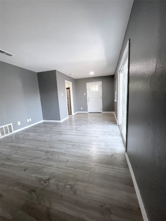 5929 Alsace Trail Austin, TX 78724 - Photo 3 of 18 a view of an empty room and wooden floor