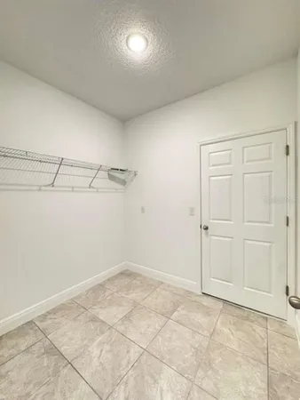 a view of a room with racks on the wall