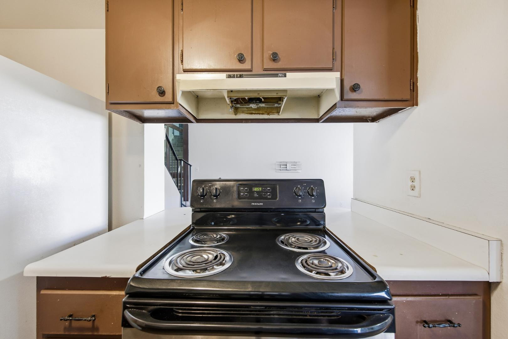 6705 West Devonshire Avenue Phoenix, AZ 85033 - Photo 5 of 11 a stove top oven sitting inside of a kitchen