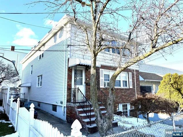 a front view of house with street