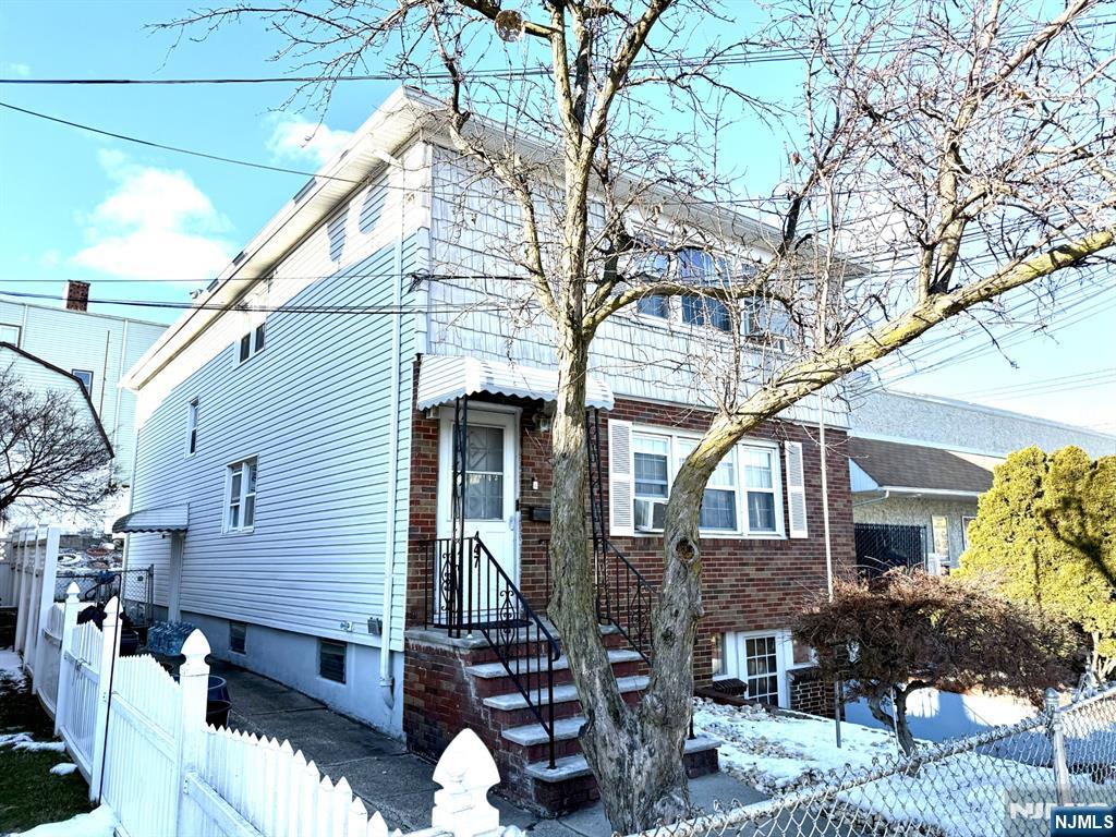 a front view of house with street