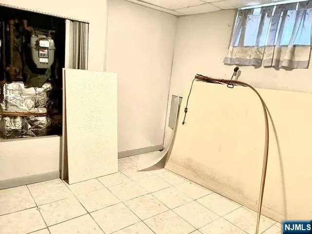a view of a hallway with couch and chandelier