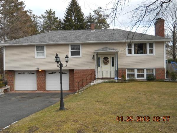 153 Cedar Road Longmeadow, MA 01106 - Photo 1 of 21 a front view of a house with yard