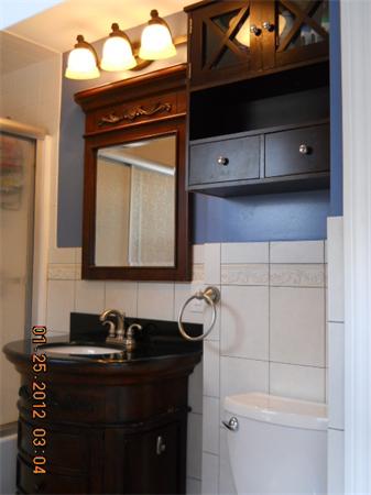 153 Cedar Road Longmeadow, MA 01106 - Photo 15 of 21 a bathroom with a sink a toilet and mirror