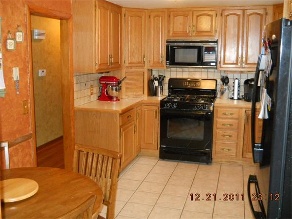 153 Cedar Road Longmeadow, MA 01106 - Photo 3 of 21 a kitchen with stainless steel appliances a stove a microwave and a refrigerator