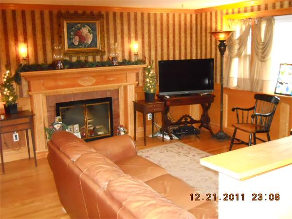 153 Cedar Road Longmeadow, MA 01106 - Photo 6 of 21 a living room with furniture a flat screen tv and a fireplace