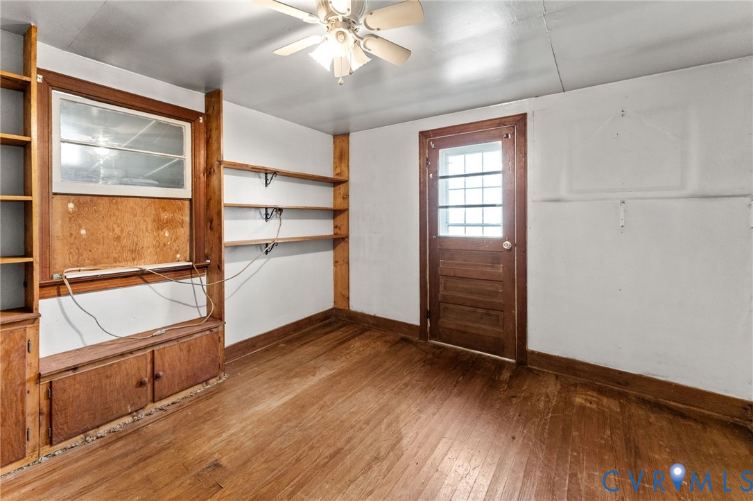 19161 Hollowing Creek Road Beaverdam, VA 23015 - Photo 21 of 27 wooden floor in an empty room with a window