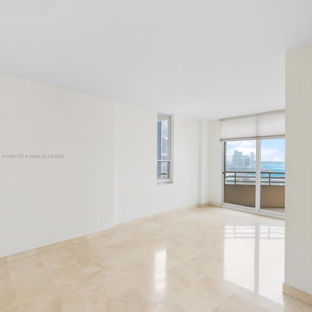 888 Brickell Key Drive, Unit 2510 Miami, FL 33131 - Photo 12 of 22 a view of an empty room with window