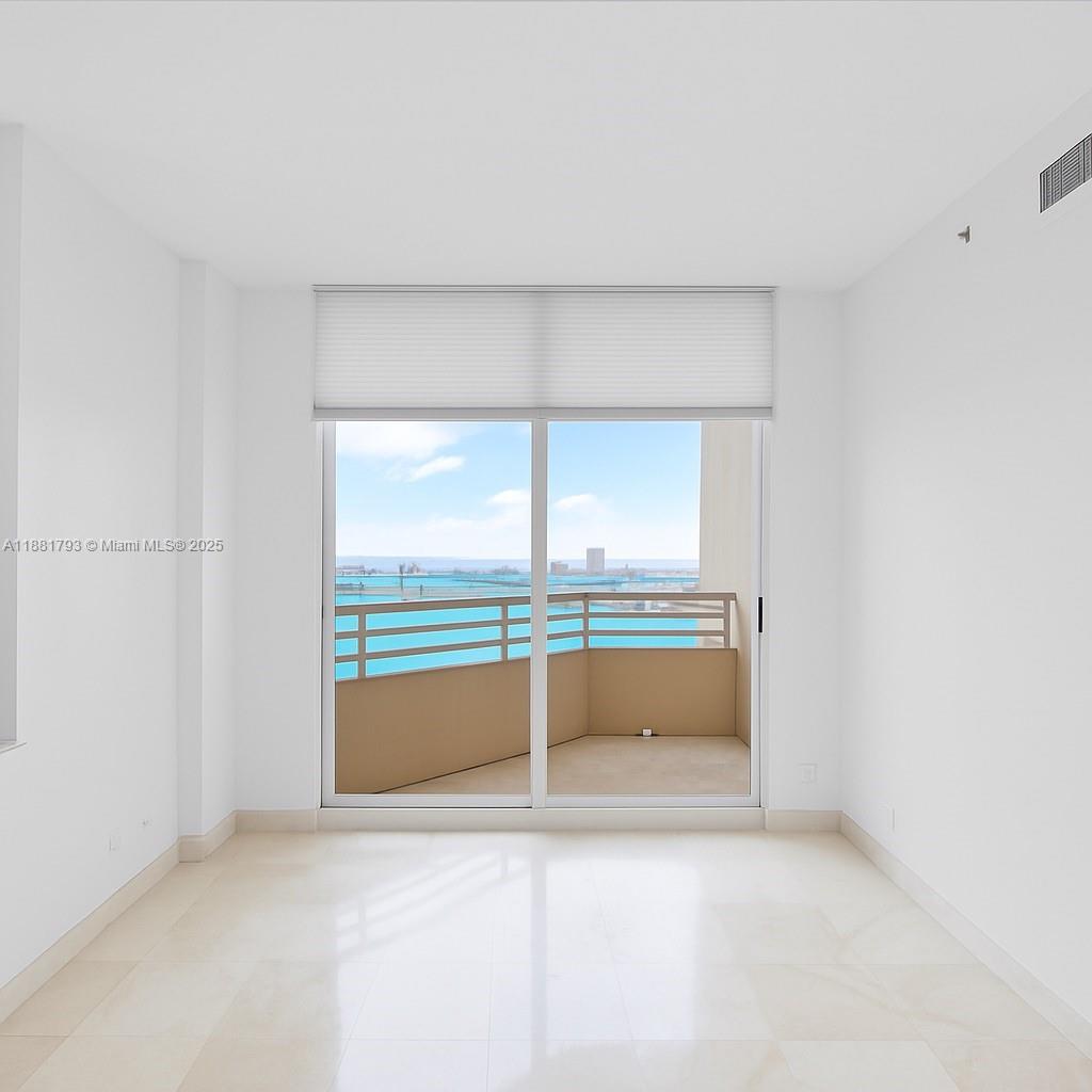 888 Brickell Key Drive, Unit 2510 Miami, FL 33131 - Photo 10 of 22 a view of an empty room with a window