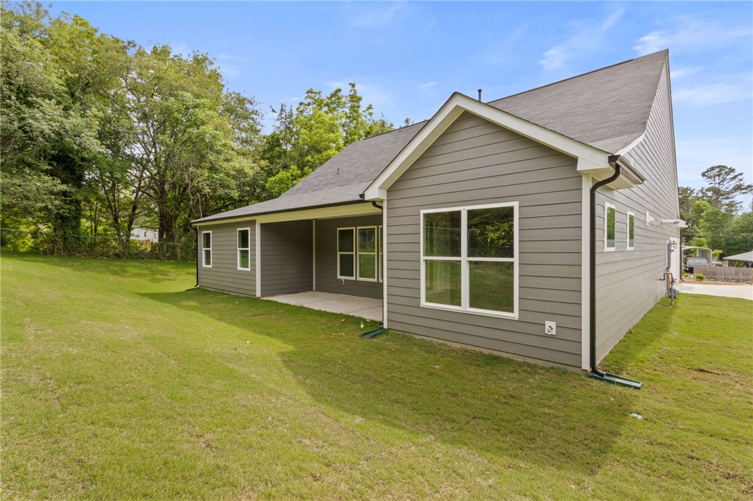 315 Old Shirley Road Central, SC 29630 - Photo 26 of 26 This home features a lush yard and a practical covered patio for outdoor enjoyment.