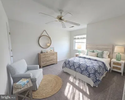 a bedroom with bed and a chandelier