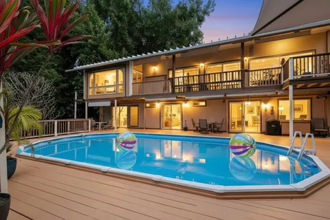 swimming pool view with a outdoor seating