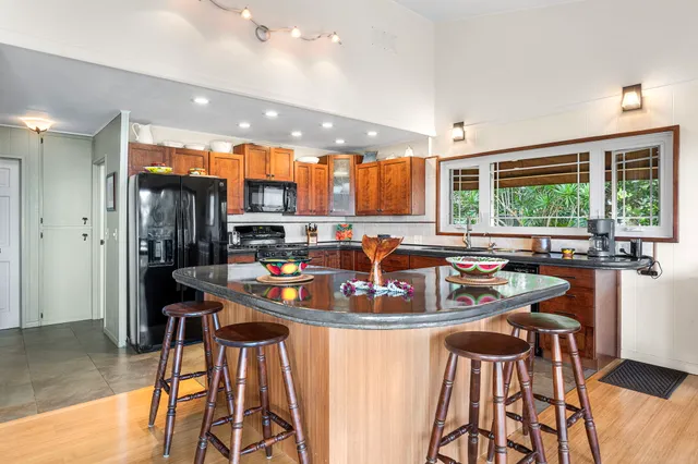 a view of a dining room with furniture wooden floor and chandelier