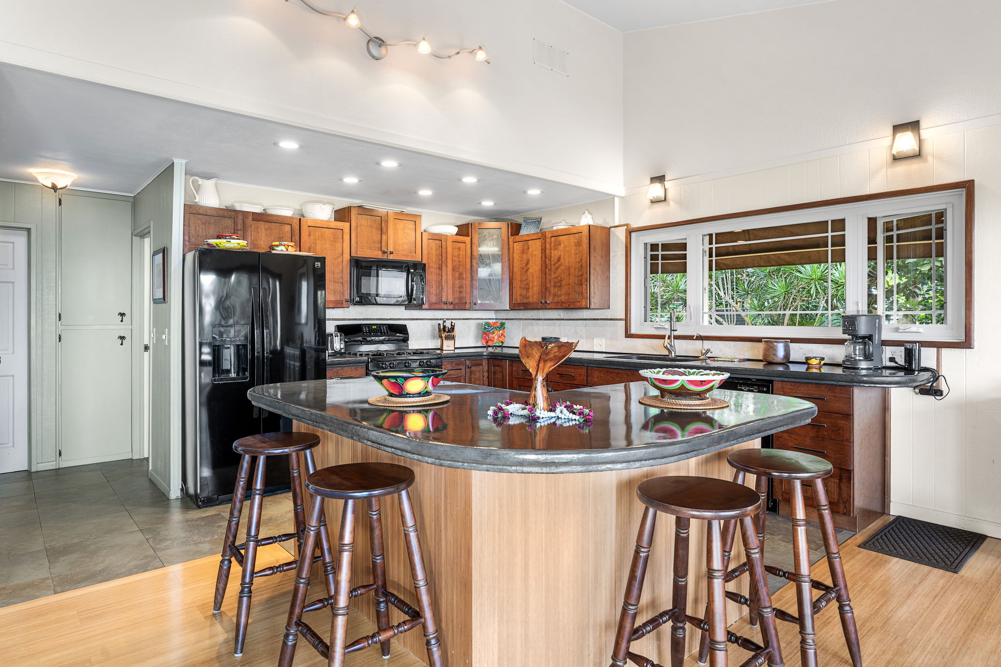 78-6960-a Walua Road Kailua-Kona, HI 96740 - Photo 12 of 29 a view of a dining room with furniture a chandelier and wooden floor