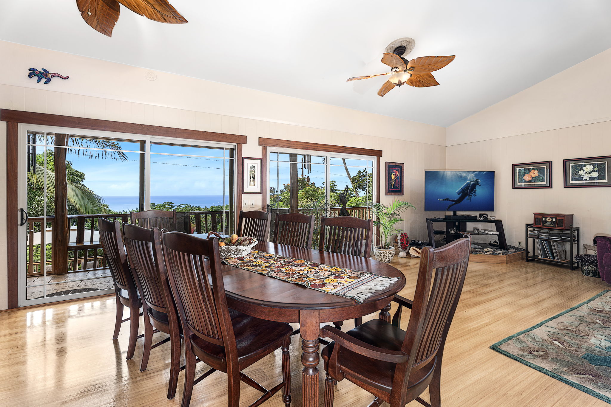 78-6960-a Walua Road Kailua-Kona, HI 96740 - Photo 13 of 29 a view of a dining room with furniture wooden floor and chandelier