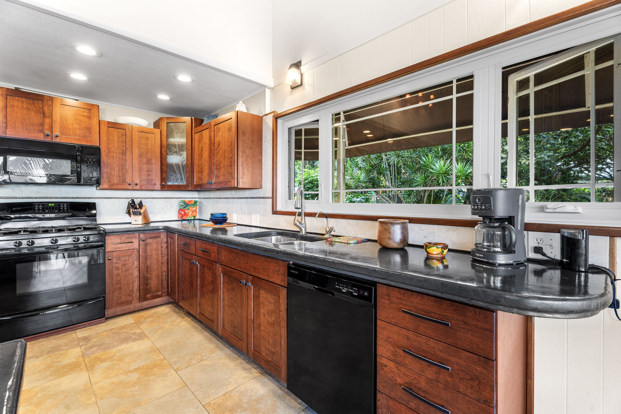 78-6960-a Walua Road Kailua-Kona, HI 96740 - Photo 15 of 29 a kitchen with stainless steel appliances granite countertop a sink and a stove