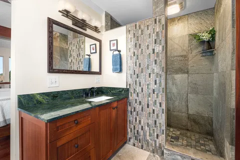 a bathroom with sink and mirror