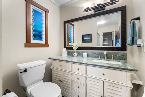 a view of a patio with table and chairs and wooden floor