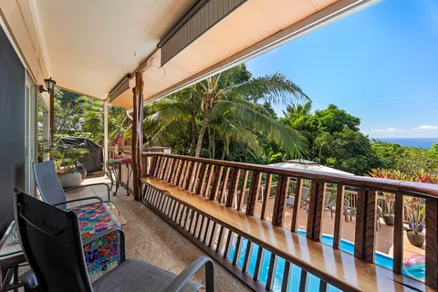 an aerial view of a house with swimming pool