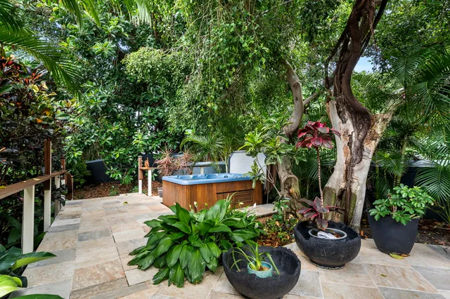 a view of front door with furniture and a gate